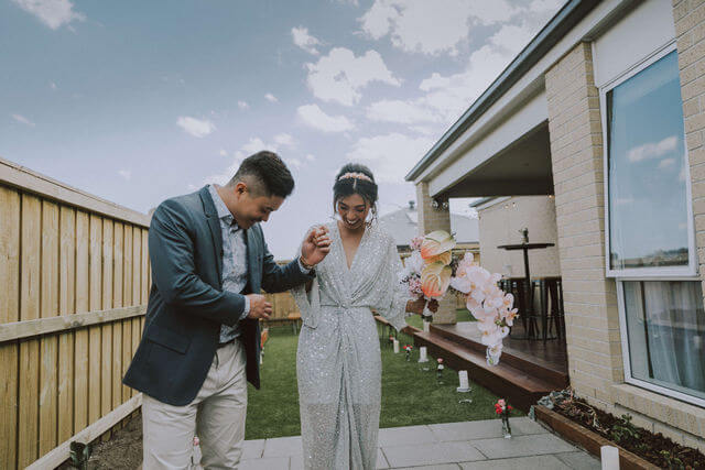 happy couple getting ready for backyard wedding in Brisbane