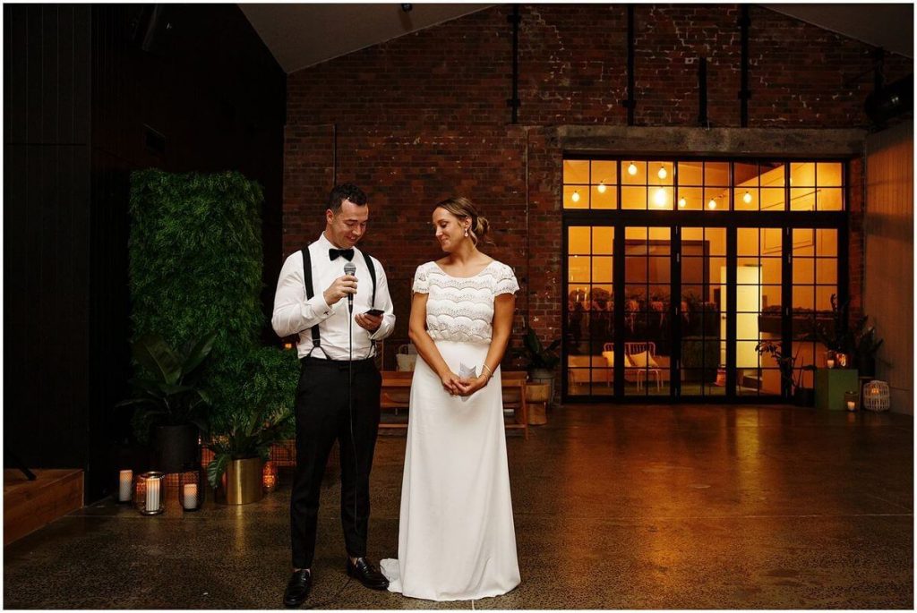 Bride and Groom speaking at warehouse wedding in Melbourne